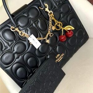 Coach Black Embossed Tote with Gold and Red Details